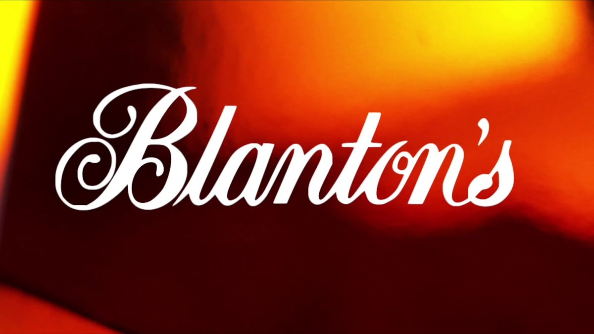 “Blanton's” title card over a warm, out-of-focus amber background, from Josh Nagel Productions' Blanton's Bourbon promo.