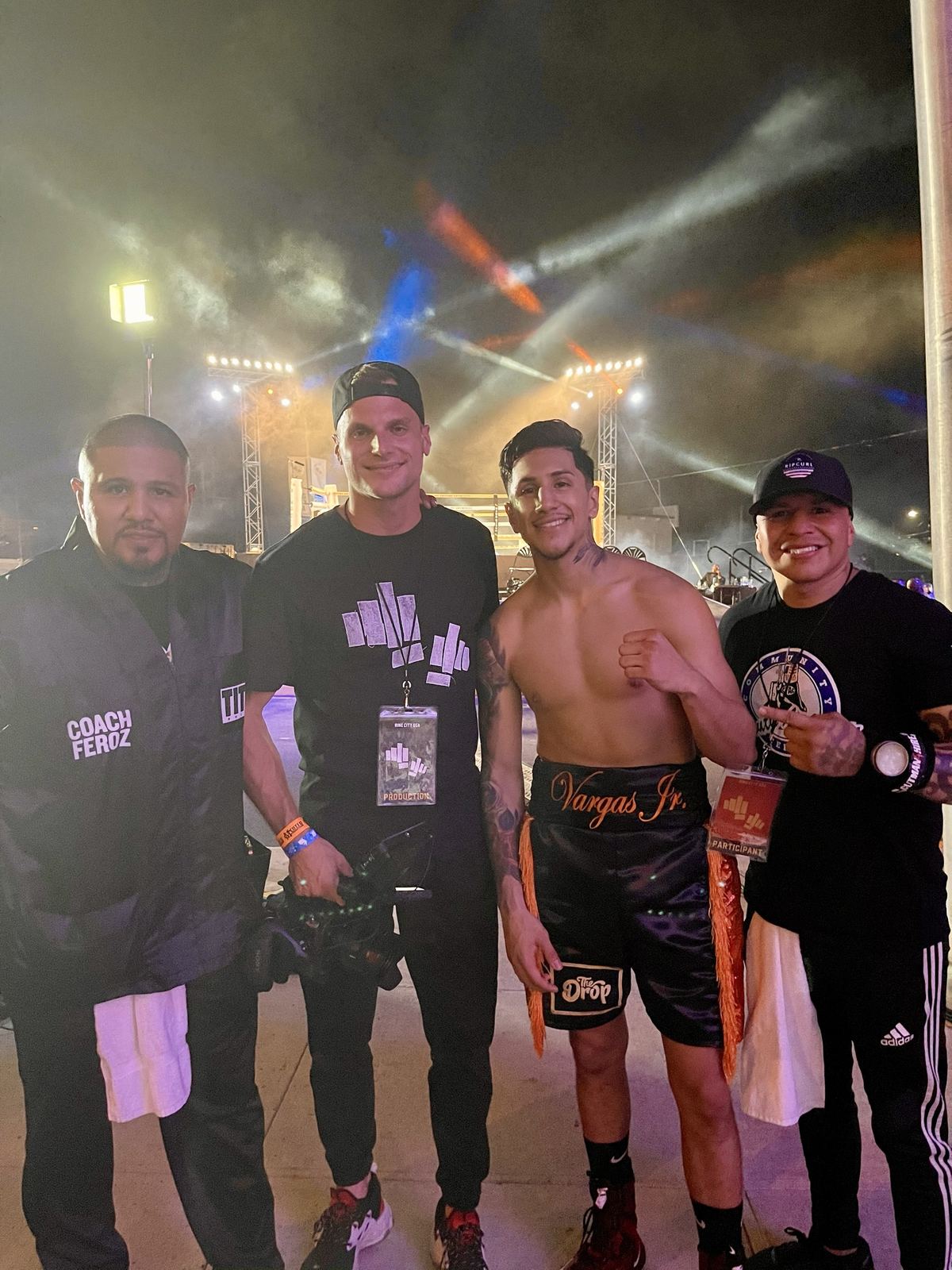 Josh Nagel with a boxer and crew backstage at a Ring City USA event, wearing a Ring City USA production lanyard.