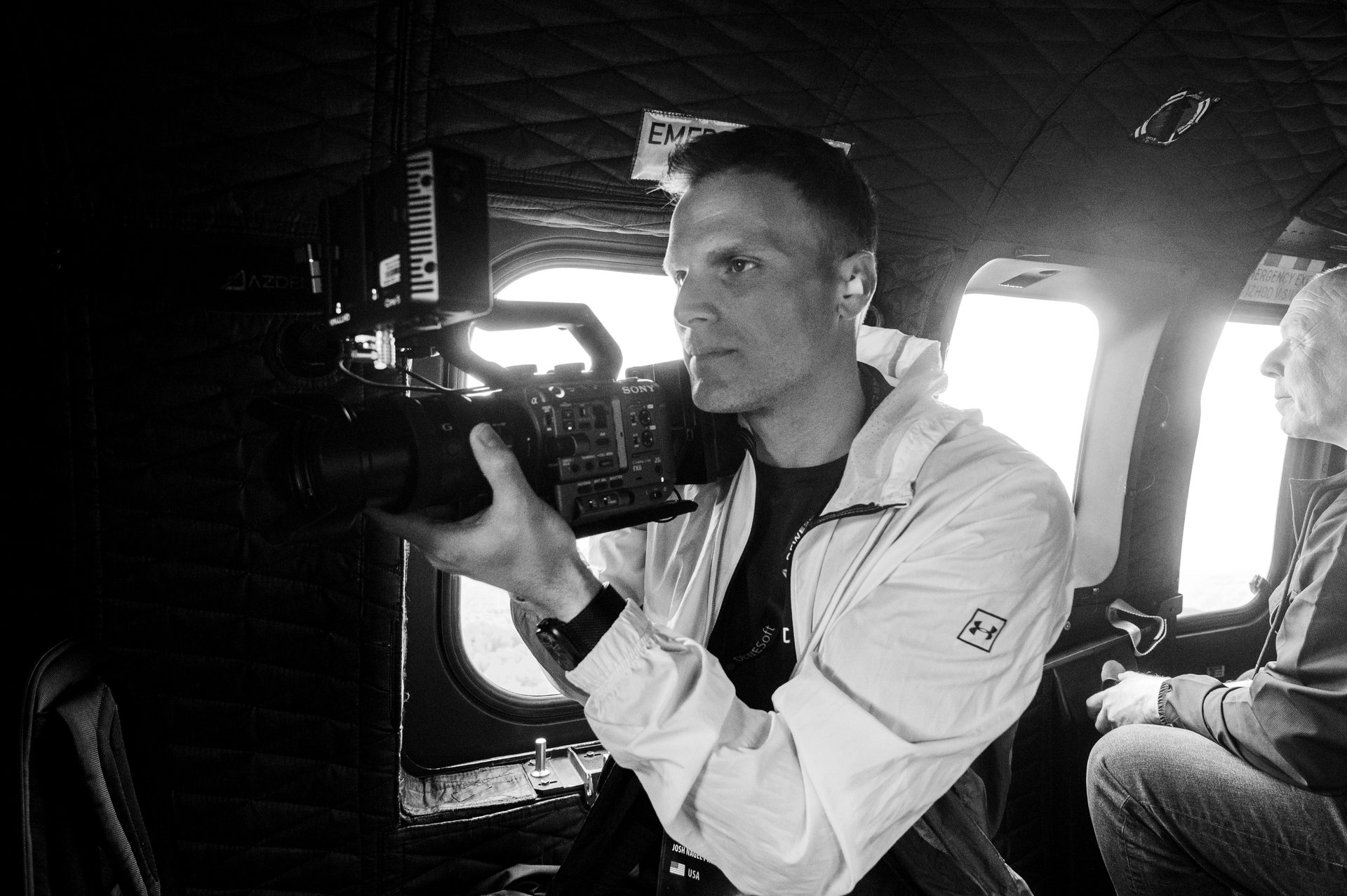 Operating a cinema camera inside a helicopter during the Dewesoft conference production.