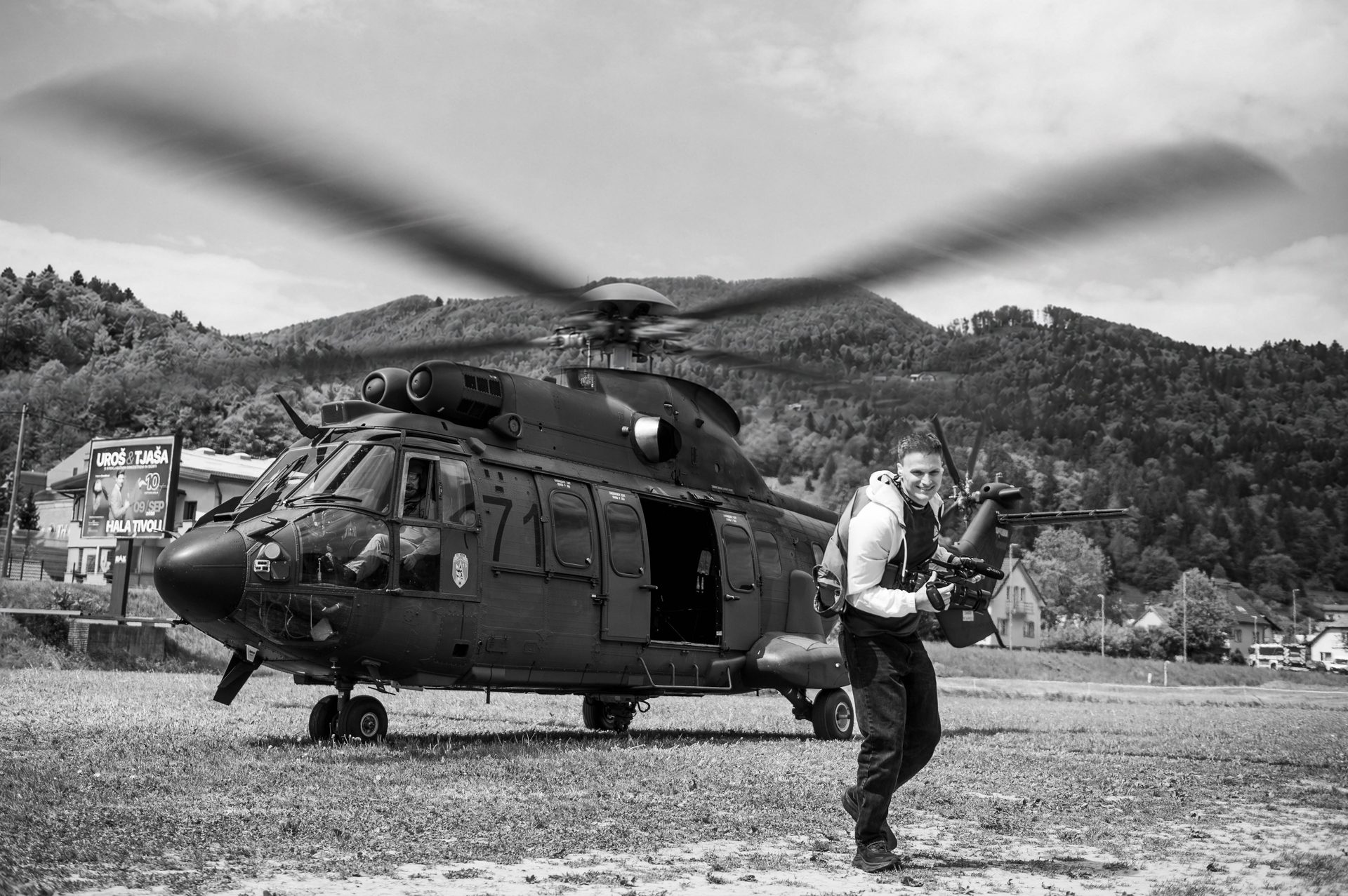 A camera operator works beside a helicopter during the Dewesoft conference production.