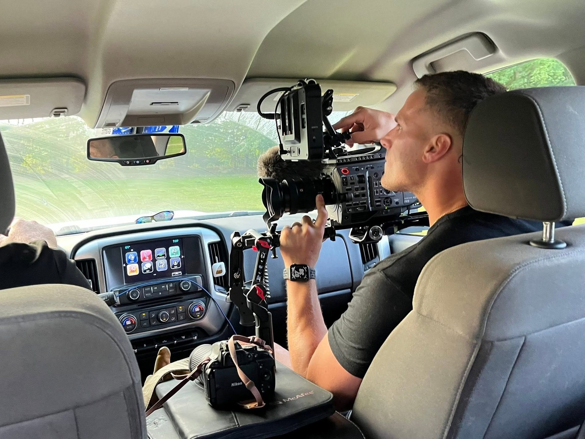 A camera operator films from a vehicle during the CIFT Patriot documentary production in Vinton, Ohio.